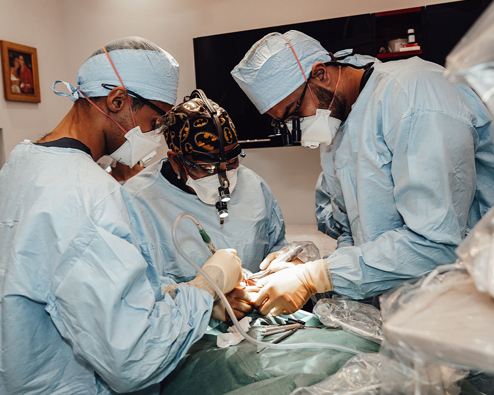 121 dental team standing together in dental surgery room